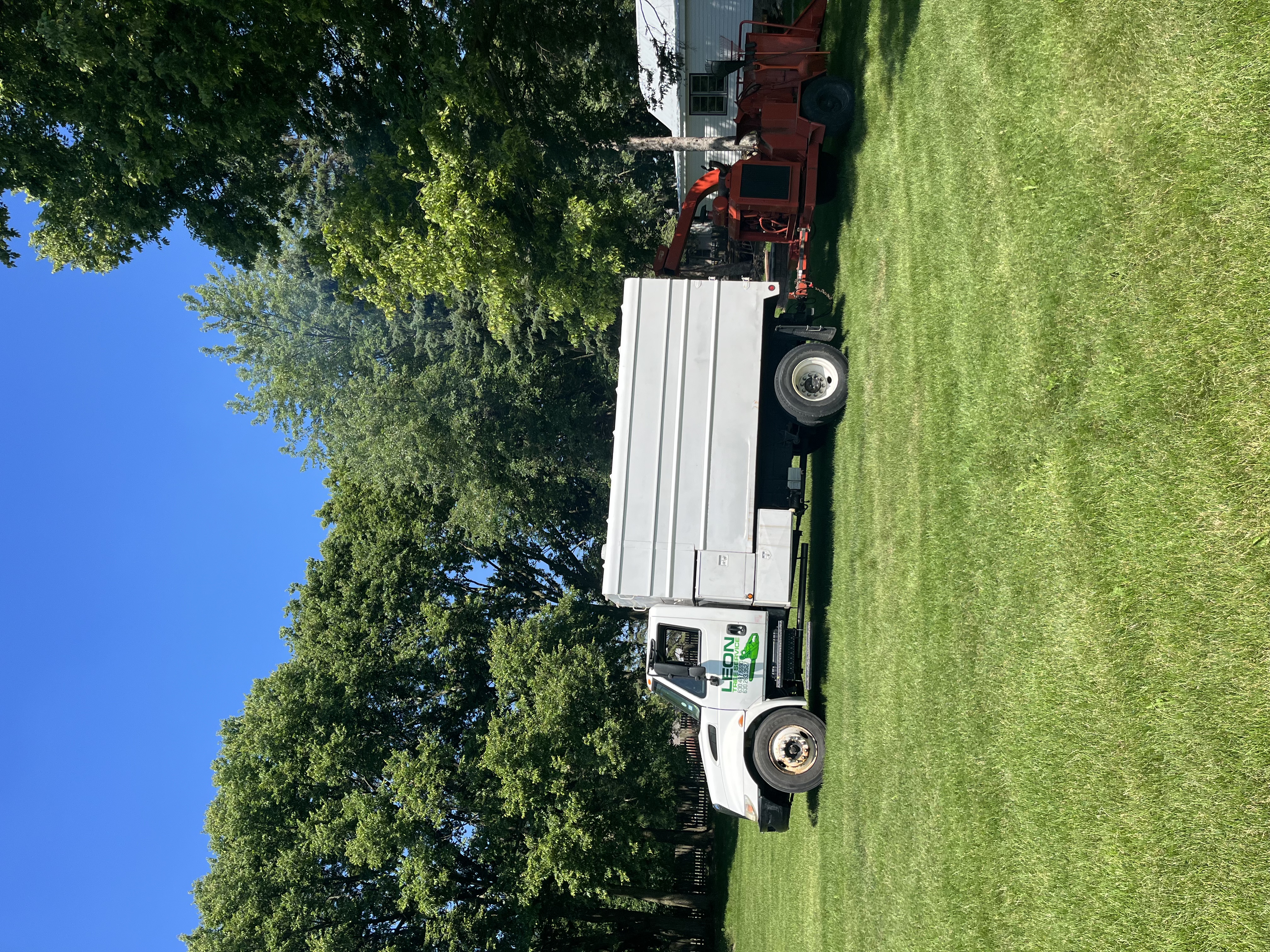 Leon Tree Services truck and equipment on job site